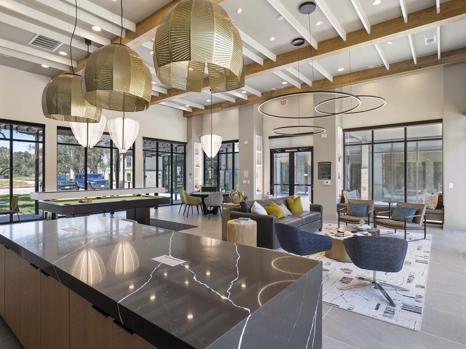Open concept community room at The Evergrove luxury apartments in Leander, TX